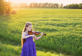 beautiful girl with violin outdoor © Maya Kruchancova