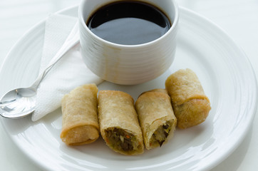Spring roll and cup of coffee.