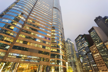 Fototapeta na wymiar Tall office buildings by night