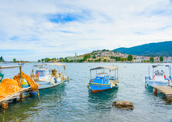 Fototapeta na wymiar Wooden pier with fishing boats at Poros island in Greece