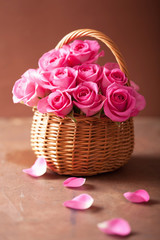 beautiful pink roses bouquet in basket © Olga Miltsova