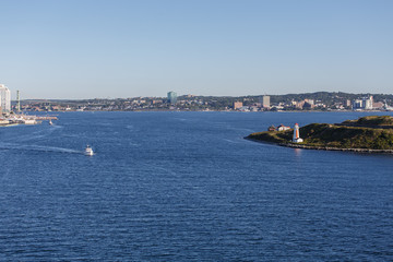 Fishing Boats Heading out past Lighthouse