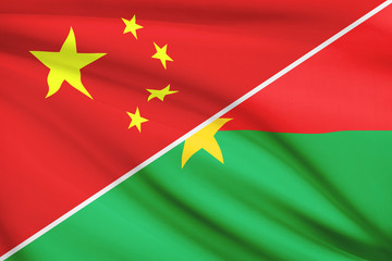 Series of ruffled flags. China and Burkina Faso.