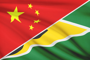 Series of ruffled flags. China and Republic of Guyana.