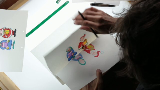 traditional animation, animator working on lightbox