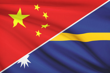 Series of ruffled flags. China and Republic of Nauru.