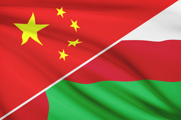 Series of ruffled flags. China and Sultanate of Oman.