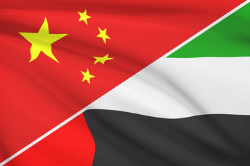 Series of ruffled flags. China and United Arab Emirates.