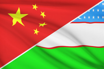 Series of ruffled flags. China and Republic of Uzbekistan.