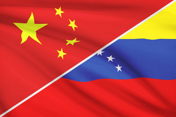Series of ruffled flags. China and Republic of Venezuela.