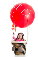child with pilot hat on hot air balloon