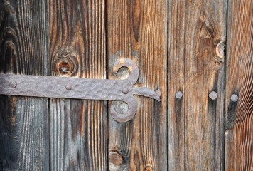 Fragments of wooden doors with hardware