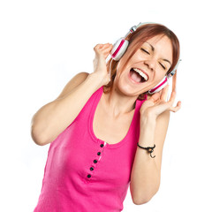 Young girl listening music over white background