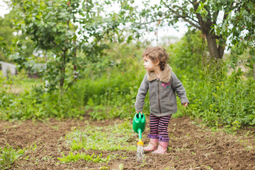 Little kid in the garden