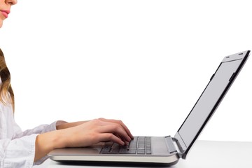 Woman typing on her laptop