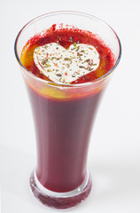 fresh squeezed juice in a tall glass with a white heart on top