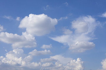 Naklejka na ściany i meble White fluffy clouds in blue sky