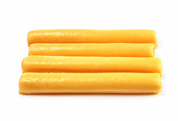 Four cheese sticks on a white background