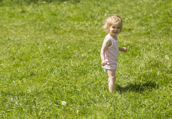 Fototapeta premium little girl in the grass