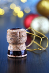 Champagne cork on Christmas lights background