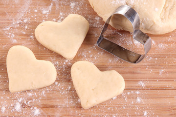 Making cookies on wooden background
