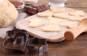 Making cookies on wooden background