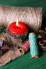 Fototapeta premium Composition with natural bump, candle, thread, cinnamon sticks