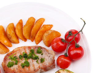 Grilled steak and grilled vegetables on plate, isolated on