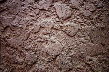 Uneven surface of cement wall.