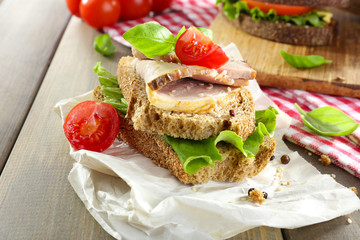 Delicious sandwiches with meet on table close-up