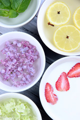 Aromatherapy treatment bowls with flowers and perfumed water