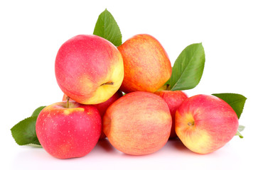 Ripe sweet apples with leaves, isolated on white