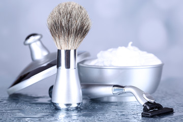 Male luxury shaving kit on table on bright background