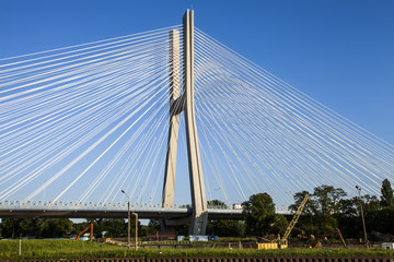 Beautiful photo of a rope bridge at sunset