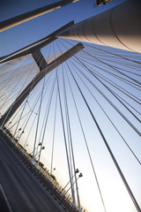 Obraz premium Beautiful photo of a rope bridge at sunset