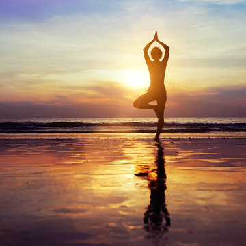 yoga on the beach, healthy lifestyle concept