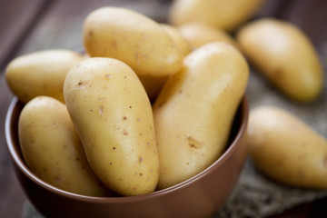 Close-up of raw potato in a glass bowl, horizontal shot