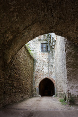 Fototapeta premium Paved road to the gate of mediaeval castle