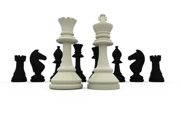 White king and queen standing in front of black pieces