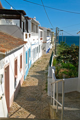 White houses and cobblestone street in fishing village