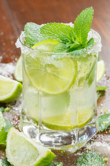 Cocktail. Glass of cocktail with ice, mint and lime