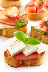 Toasted bread with fresh goat cheese and tomato