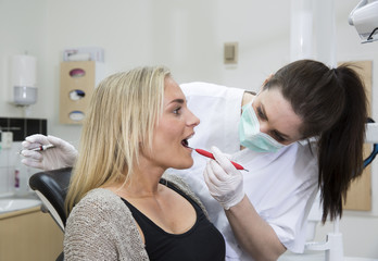 Female dentist and patient