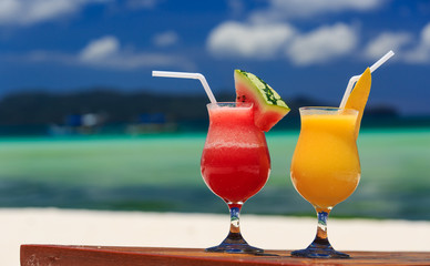 fruit cocktails on tropical beach