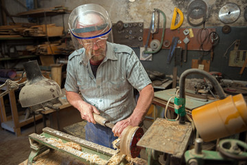 The man works in the home joinery.