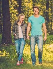 Fototapeta premium Happy teenage couple outdoors on sunny day
