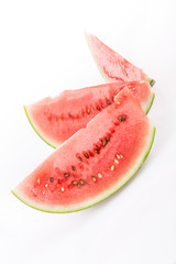 sliced watermelons on white
