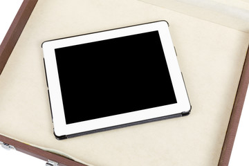 Modern white tablet pc in briefcase isolated on white
