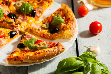 Pizza with bacon, olives and jalapeno pepper