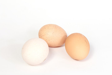 three chicken eggs